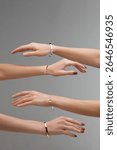 Multiple hands display different bracelets in a visually appealing manner, emphasizing the intricate designs and variety of materials used in contemporary jewelry fashion.