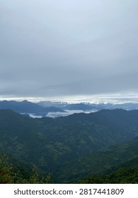 Multiple high hills under the blue sky seen from height