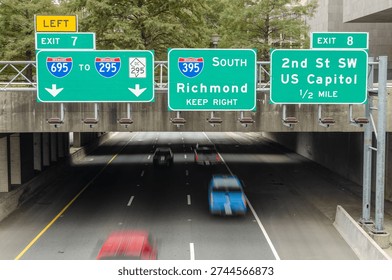 Multiple Interstate Direction Signs over Highway Tunnel in Washington DC. U.S.A.

Vehicles pass beneath large freeway signs directing drivers toward Richmond, Southwest Waterfront, and local DC exits. A transportation-focused view of urban driving routes.