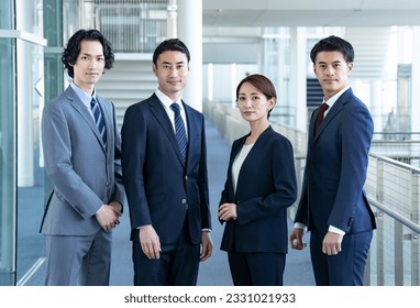 Multiple Japanese businessmen in a building - Powered by Shutterstock