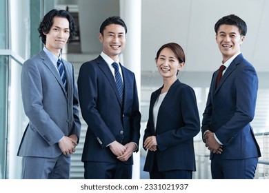 Multiple Japanese businessmen in a building - Powered by Shutterstock