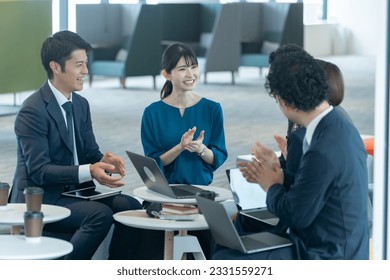 Multiple Japanese businessmen in suits - Powered by Shutterstock