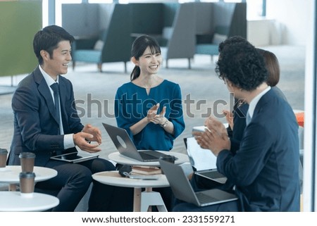 Multiple Japanese businessmen in suits