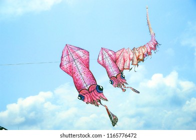 Multiple Kites On A Row Against A Blue Sky,kite Clubs From Local And International Took Part ,kite Festival In Thailand