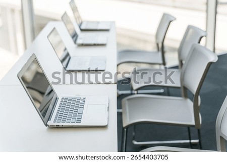 Multiple laptops in an office
