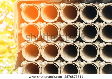 Multiple launch rocket system barrels. sky background. close-up