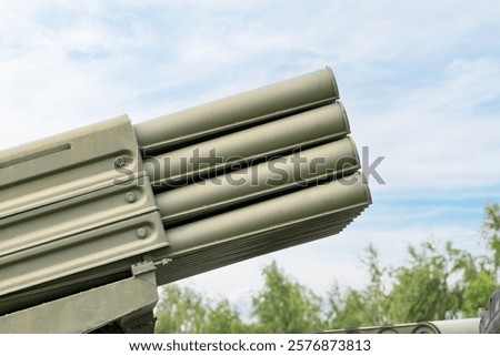 Multiple launch rocket system barrels. sky background. close-up