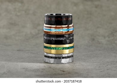 Multiple Mens Tungsten Rings Stacked On A Stone Background For Engagement