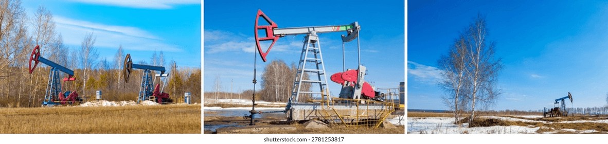 Multiple oil pump jacks distributed across a flat landscape during the transition from winter to spring. Patches of white snow contrast with the brown earth and thin trees.