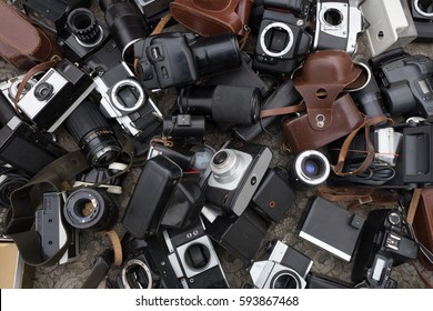 Multiple Old Cameras And Lenses At Flea Market