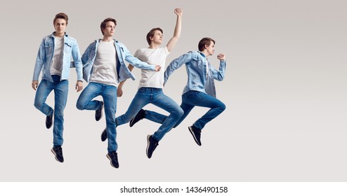 Multiple Portrait Of A Jumping Handsome Hipster Man Wearing Jeans Jacket On White Background In Studio