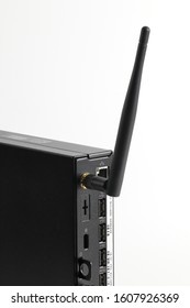 Multiple Ports And Wifi Antenna On Back Side Of Tiny Computer Or Micro Form Factor Computer, Small Form Factor Computer Or Multimedia Box Or Android Box Isolate On White Background