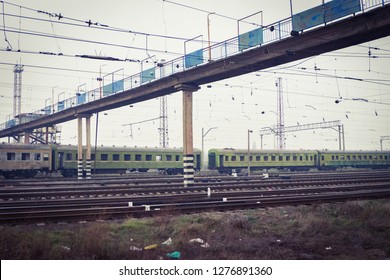 Multiple rail lines with trains. Trainyard with modern and old trains. 