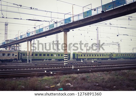 Multiple rail lines with trains. Trainyard with modern and old trains. 