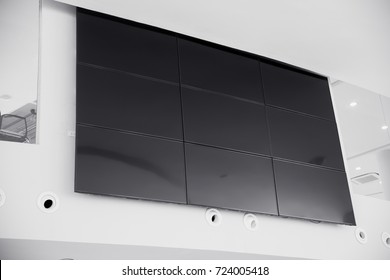 Multiple Screen LCD Panel Display In Modern Building Office Wall With Clipping Path At Screen 