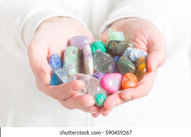 Multiple Semi Precious Gemstones In Hands