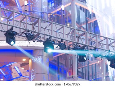 Multiple Spotlights On A Theatre Stage Lighting Rig 