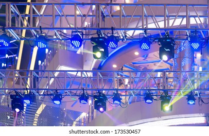 Multiple Spotlights On A Theatre Stage Lighting Rig 