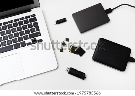 Multiple storage devices, pendrive, external USB disk, memory cards on laptop