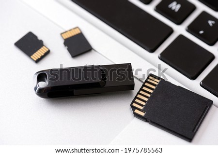Multiple storage devices, pendrive, memory cards on laptop