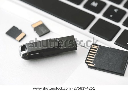 Multiple storage devices, pendrive, memory cards on laptop
