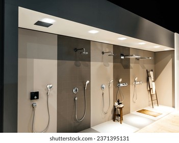 multiple types of showers - presentation inside a modern showrioom for bathroom appliances and accesories