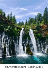 Multiple Waterfalls Cascading Out Of The Forest