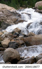 Multiple Waterfalls Cascading Over Boulders.