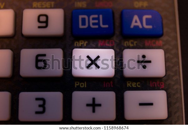 Multiplication\
key of a scientific calculator\
keyboard