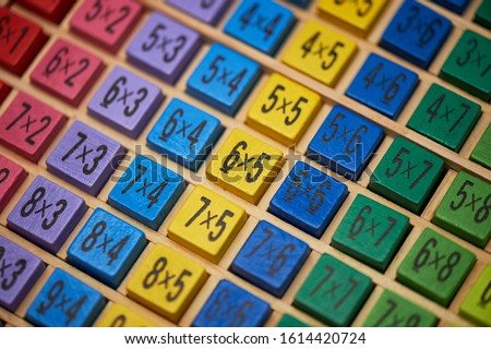 Multiplication table . Macro mode. Colored wooden cubes.Teaching children math and numeracy. Mental math.
