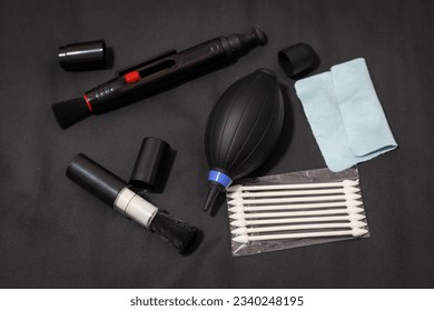 Multi-purpose cleaning kit for lens elements, electronic equipment