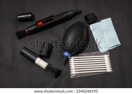 Multi-purpose cleaning kit for lens elements, electronic equipment