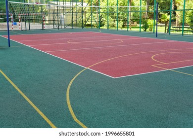 A multipurpose playground with rubber coating and markings for tennis, basketball and volleyball. - Powered by Shutterstock