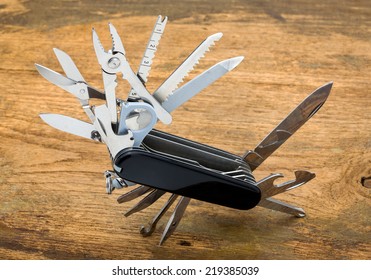 multipurpose pocket knife on wood