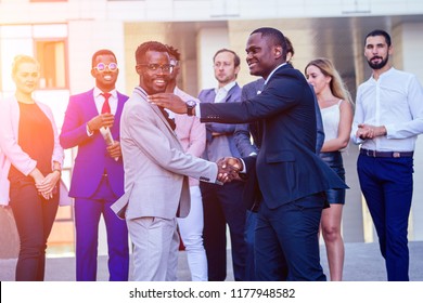 Multiracial african men handshaking at meeting and making deal shaking hands to businessman multinational and multiethnic corporate business people . Greeting Deal Concept