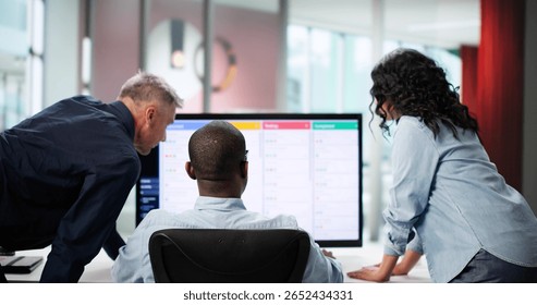 Multiracial Agile Developer Team Collaborating On Kanban Board In Office