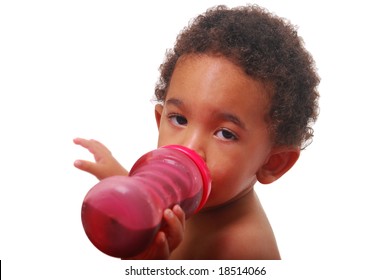 A multi-racial baby boy drinking.