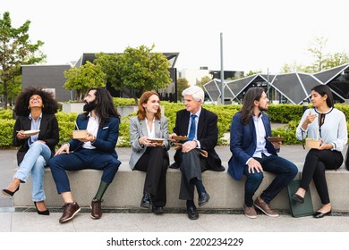 Multiracial Business People With Different Ages Having A Lunch Break Outside Office