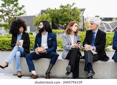 Multiracial business people with different ages having lunch break outside office - Powered by Shutterstock