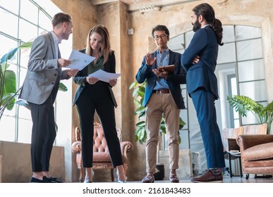 Multiracial Business People Discussing In Their Office Building About New Sustainable Project