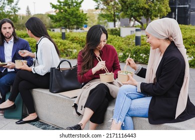 Multiracial Business People Eating Fresh Poke Food During Lunch Break Outside Of Office
