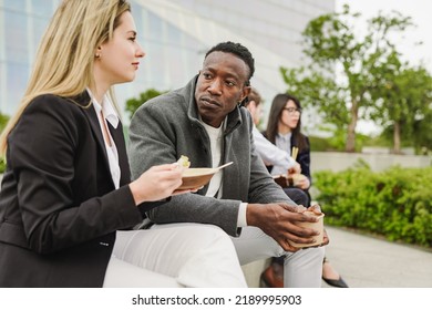 Multiracial Business People Eating Together Poke Food During Lunch Break Outside Of Office