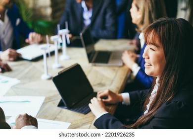 Multiracial Business People Working On Sustainable Innovation Project - Focus On Asian Woman Face