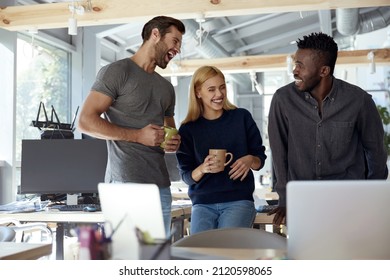 Multiracial business team laughing and drinking tea or coffee during break at work at office. Concept of rest and break at work. Idea of modern successful people. Business and entrepreneur lifestyle - Powered by Shutterstock