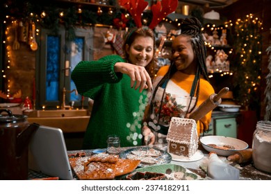 Multiracial couple of Women Making cookies together for Christmas - Powered by Shutterstock