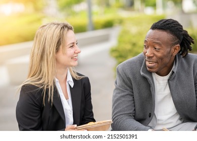 Multiracial Coworkers Talking Outdoors While Having Lunch - Business People Concept -