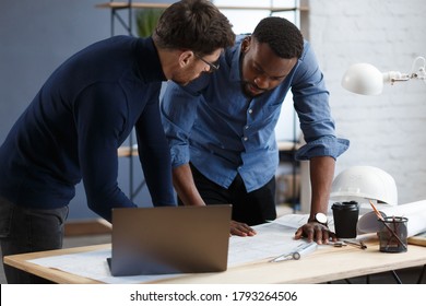 Multiracial Engineer Team Working In Office With Blue Prints And Architect Equipment Sketching,discussing And Planning Construction Project. Partners Disputing At Work. Business Construction Concept.