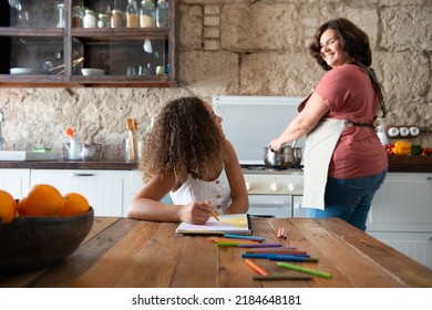 Multiracial Family Sharing Their Time In The Kitchen Of The Home