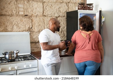 Multiracial Family Sharing Their Time In The Kitchen Of The Home