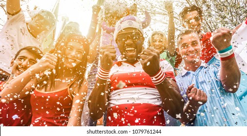 Multiracial Football Supporters Celebrating Begin Of World Competition - Happy Multiracial People Having Fun Together Outside Of Stadium - Main Focus On Black Man Face - Sport And Bonding Concept